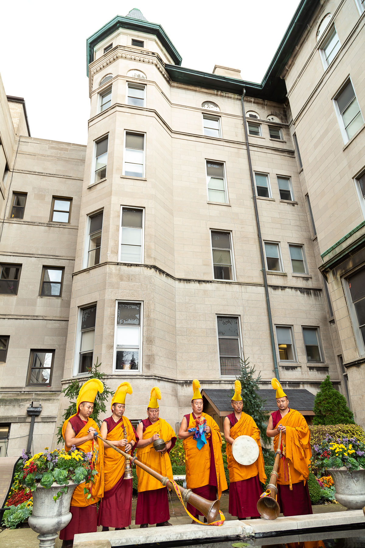 The monks continued the closing ceremony at the reflection pond in the Vincentian Residence courtyard. Their visit was sponsored by the DePaul Center for Religion, Culture and Community and the Department of Religious Studies. (DePaul University/Jeff Carrion)